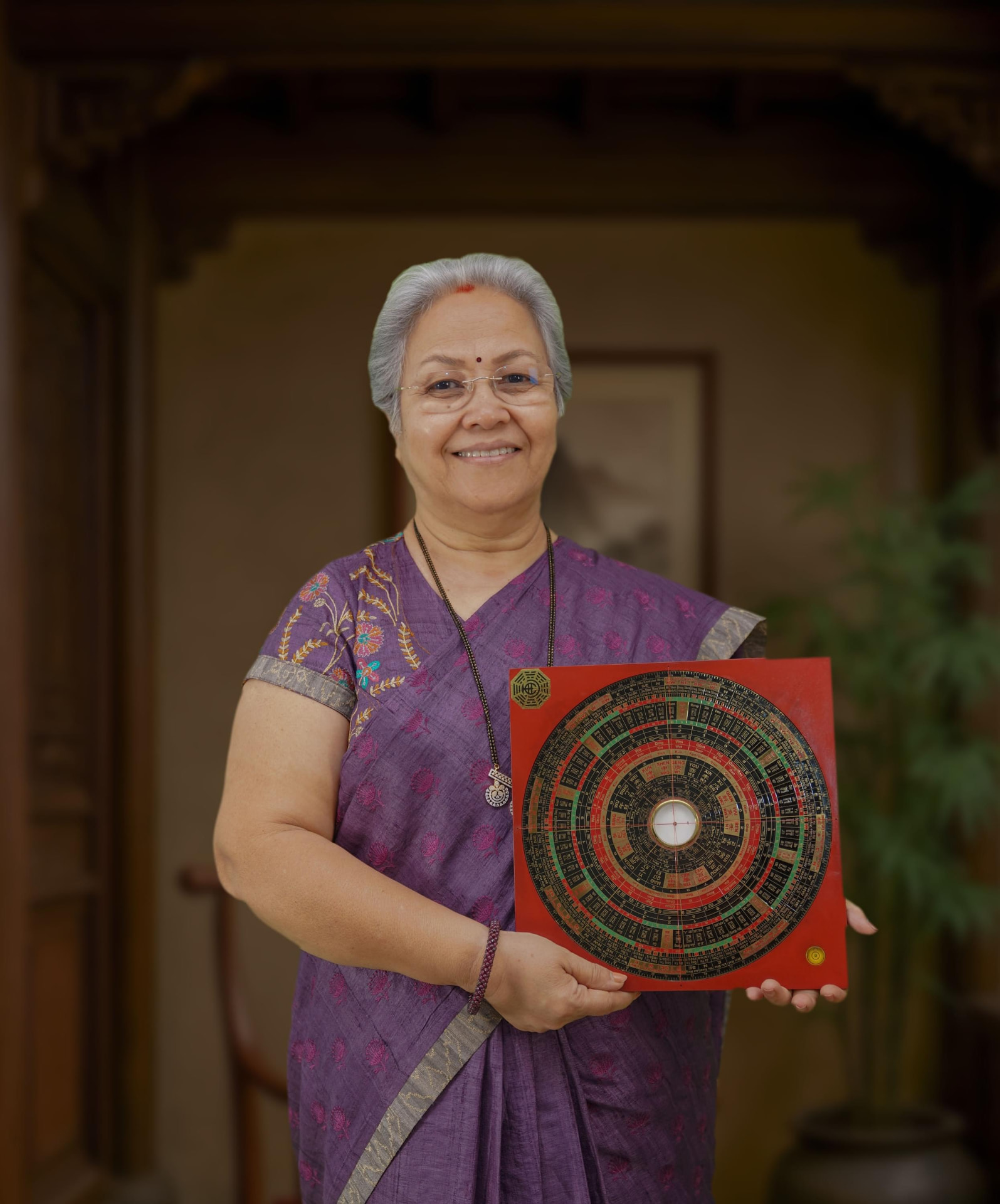 Sharda Karve holding a traditional energy chart
